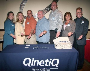 At the November event, QinetiQ North America is represented by (l-r) Alden Reynoso, Holly Kimmel, Kevin Bock, Lloyd Biggs, Mike Malmgren, Debra Geiger and Mark Witzel.